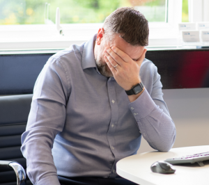 Man with head in hands